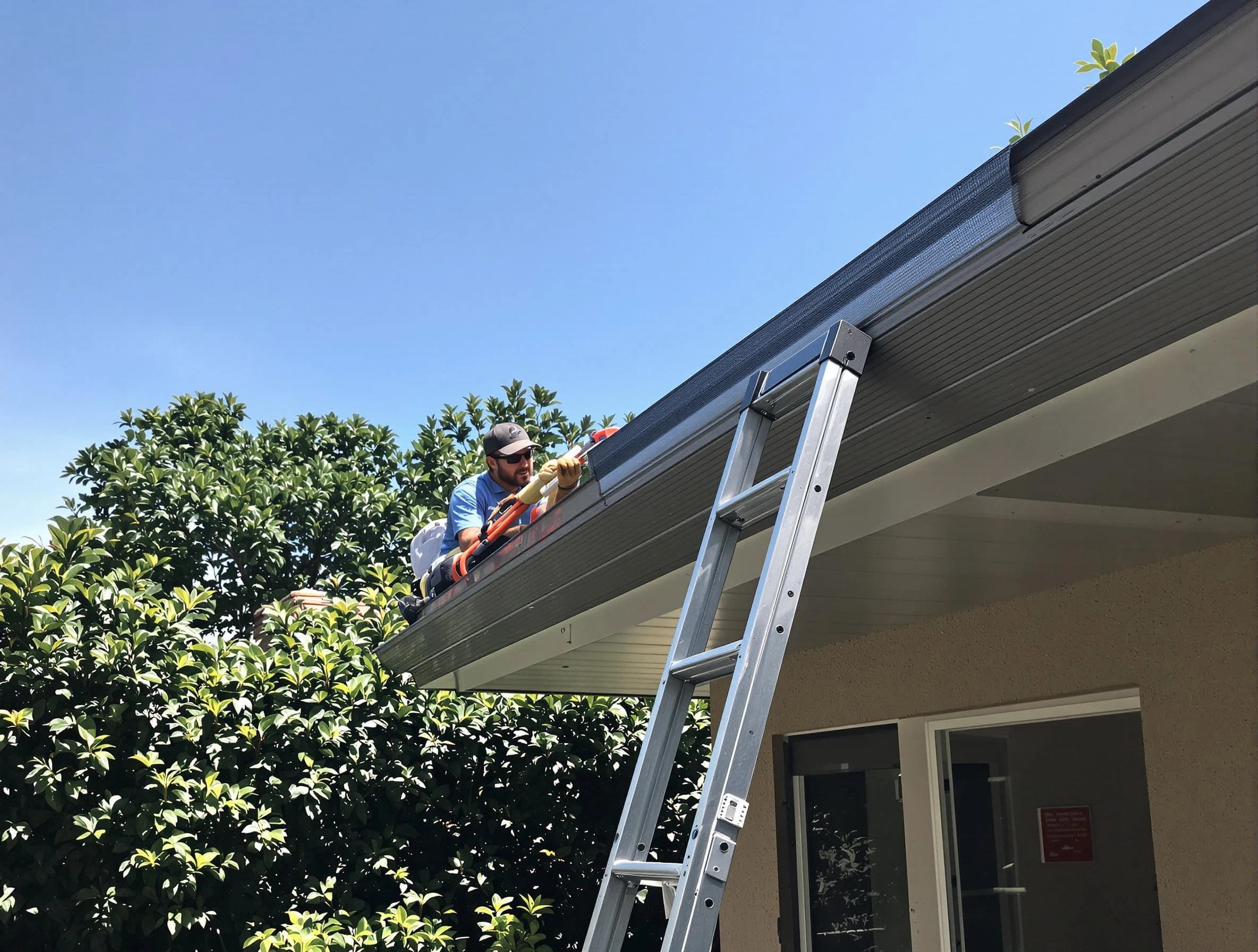 Mentor Roofing Company installing gutter guards for a homeowner in Mentor, OH